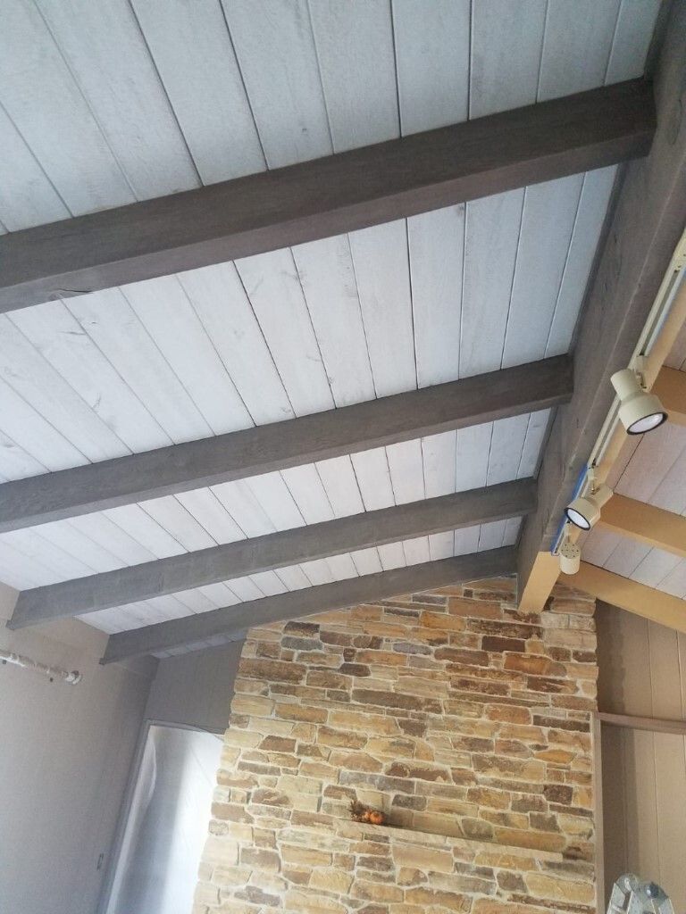 Whitewashed plank ceiling