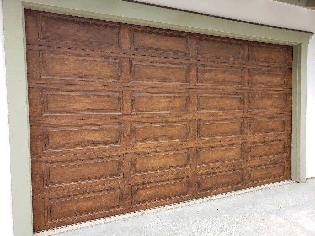 Garage door after faux wood finish