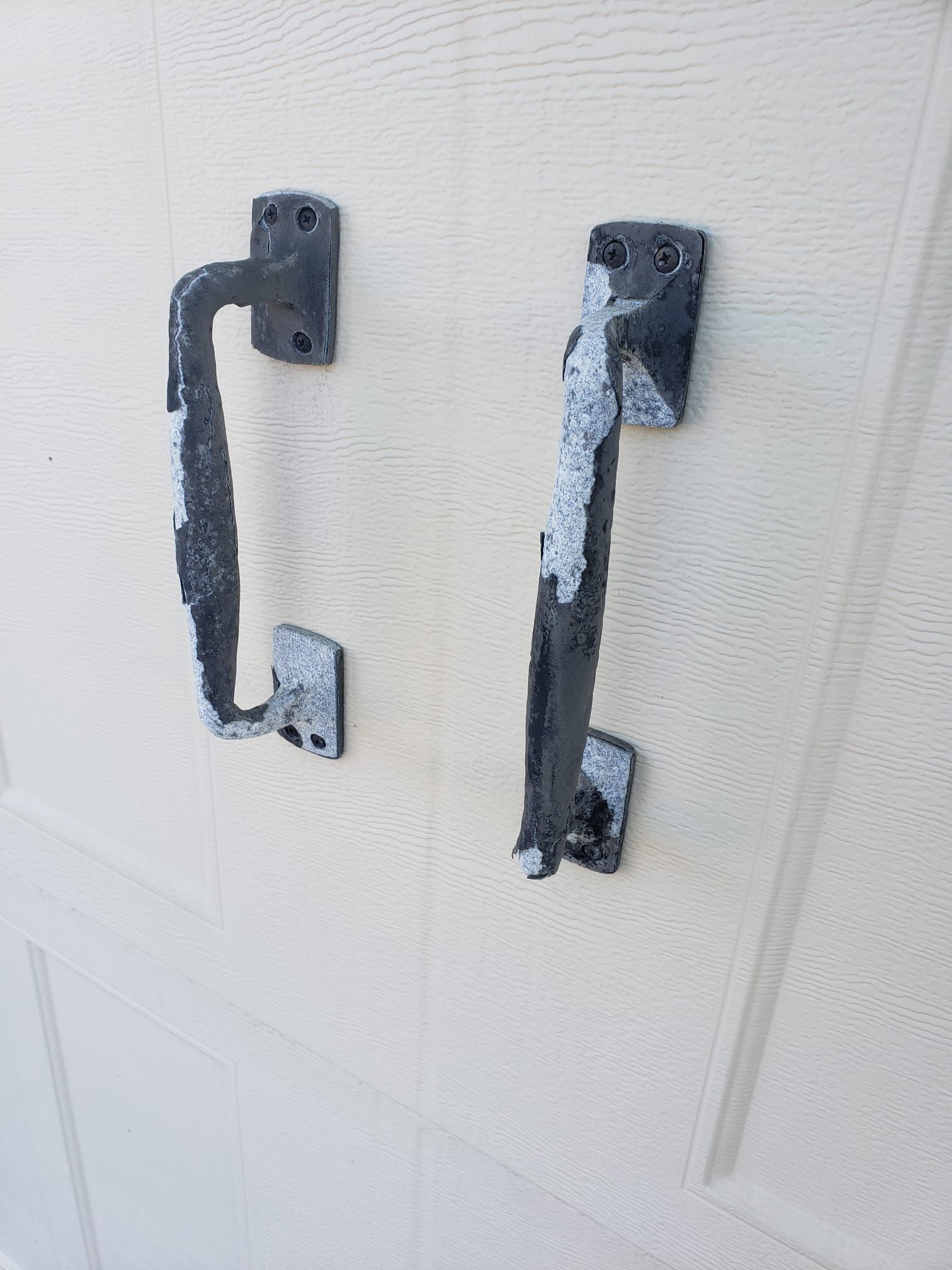 Peeling and rusted exterior garage handle